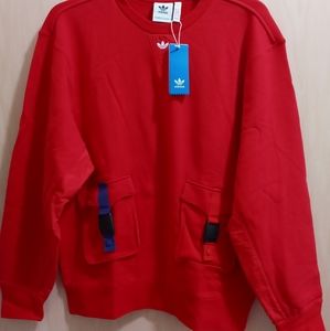 Men's Adidas Crew neck sweatshirt with snap pockets.